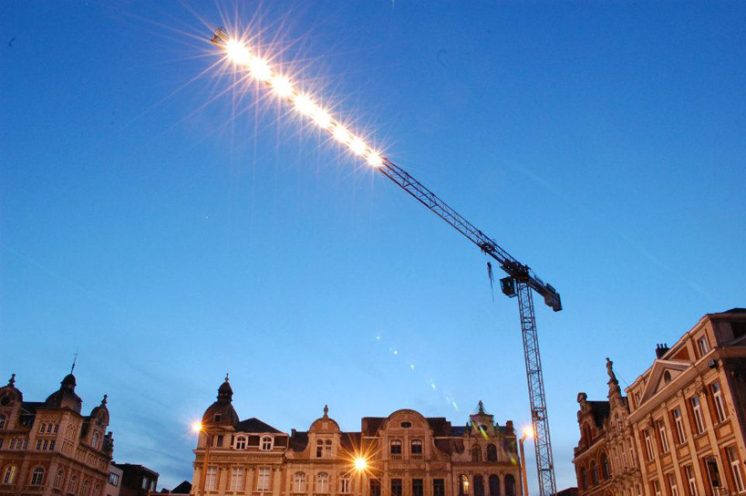 pivoting crane lamp by gijs van vaerenbergh creates 'skylight' in belgium