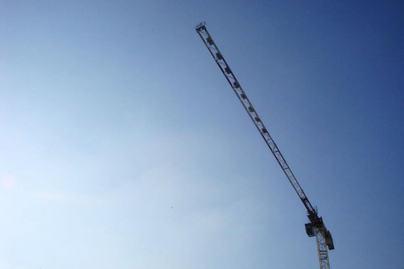 pivoting crane lamp by gijs van vaerenbergh creates 'skylight' in belgium