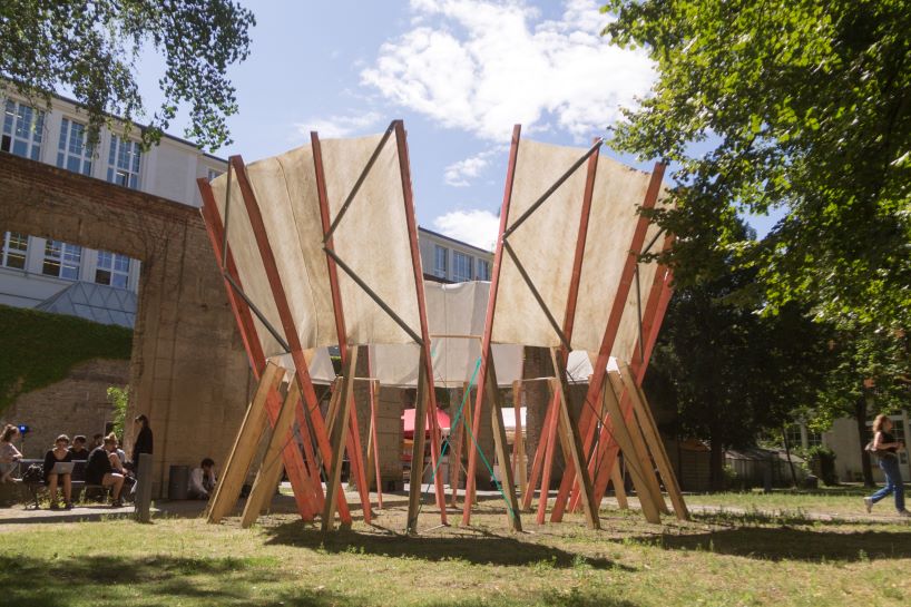 salvaged construction waste shapes material circle pavilion in berlin