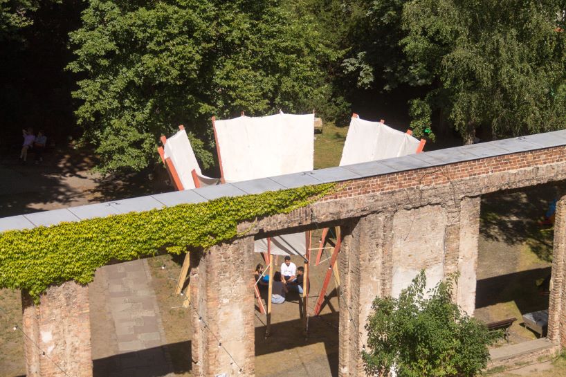 salvaged construction waste shapes material circle pavilion in berlin