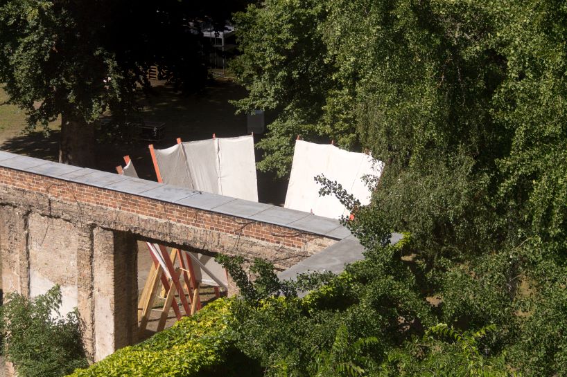 salvaged construction waste shapes material circle pavilion in berlin