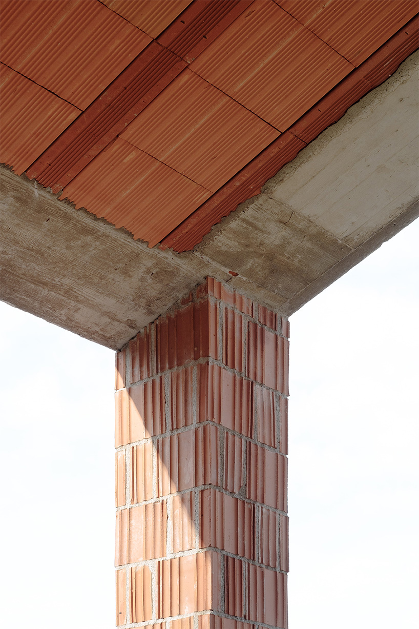 exposed materials animate textured decorative patterns within rural house in italy