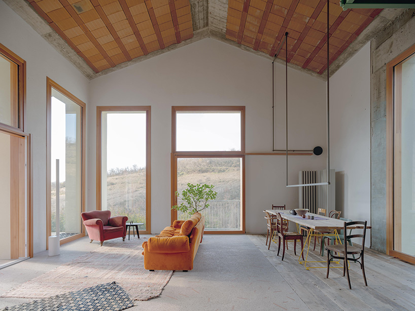 exposed materials animate textured decorative patterns within rural house in italy