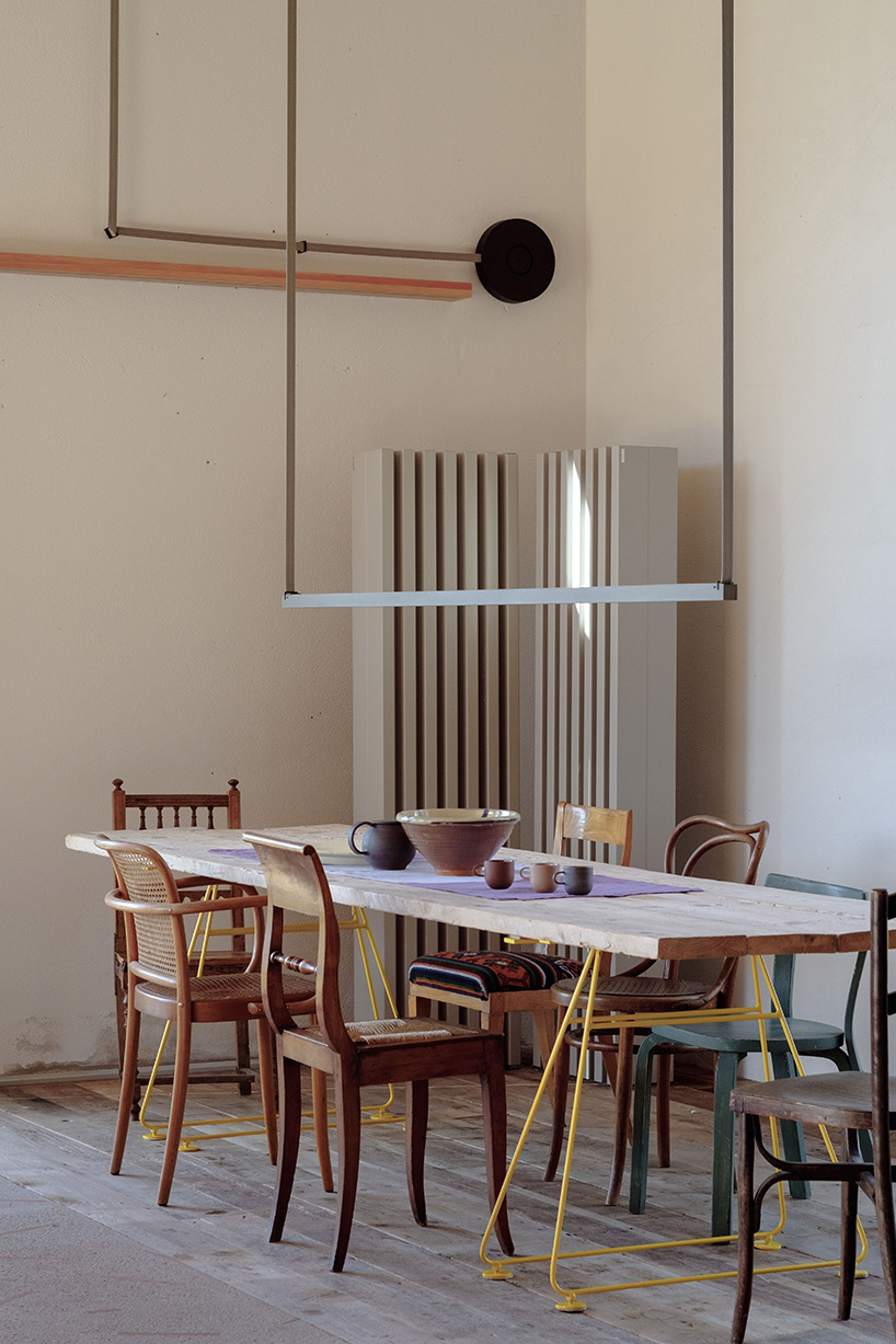 exposed materials animate textured decorative patterns within rural house in italy