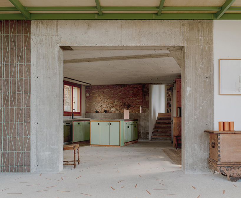 exposed materials animate textured decorative patterns within rural house in italy
