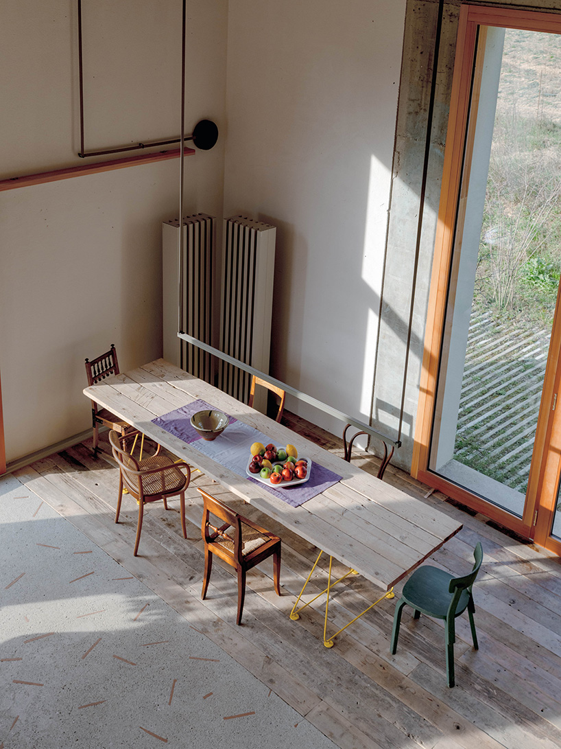exposed materials animate textured decorative patterns within rural house in italy