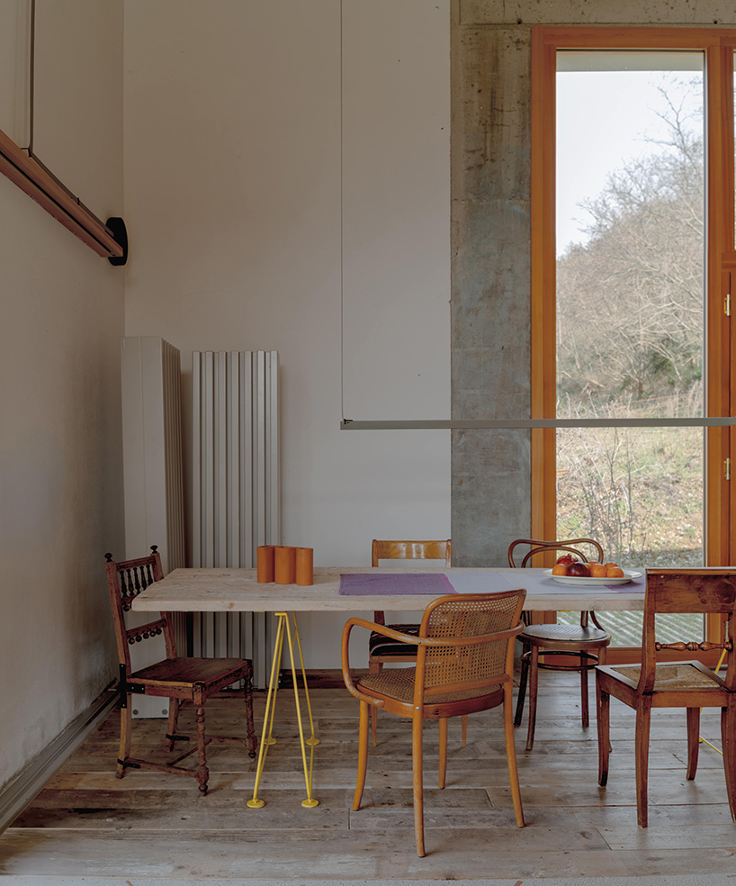 exposed materials animate textured decorative patterns within rural house in italy