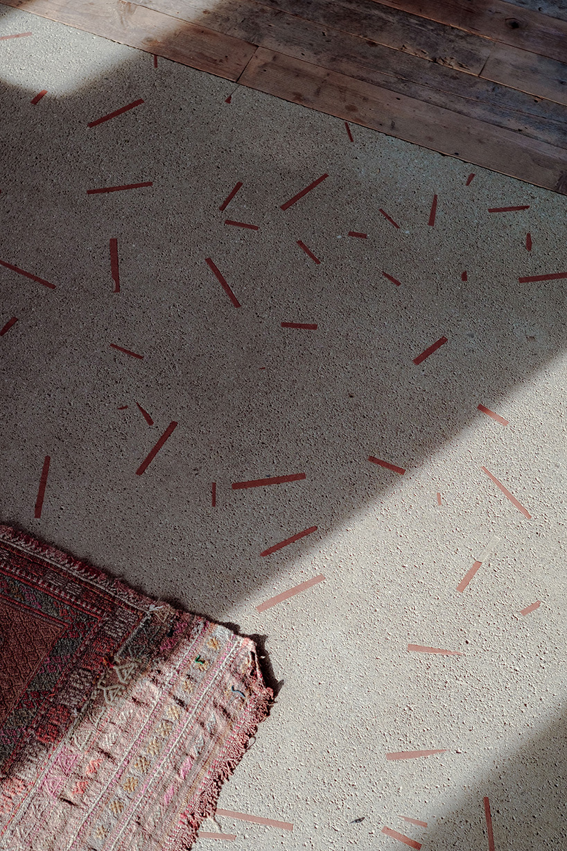 exposed materials animate textured decorative patterns within rural house in italy