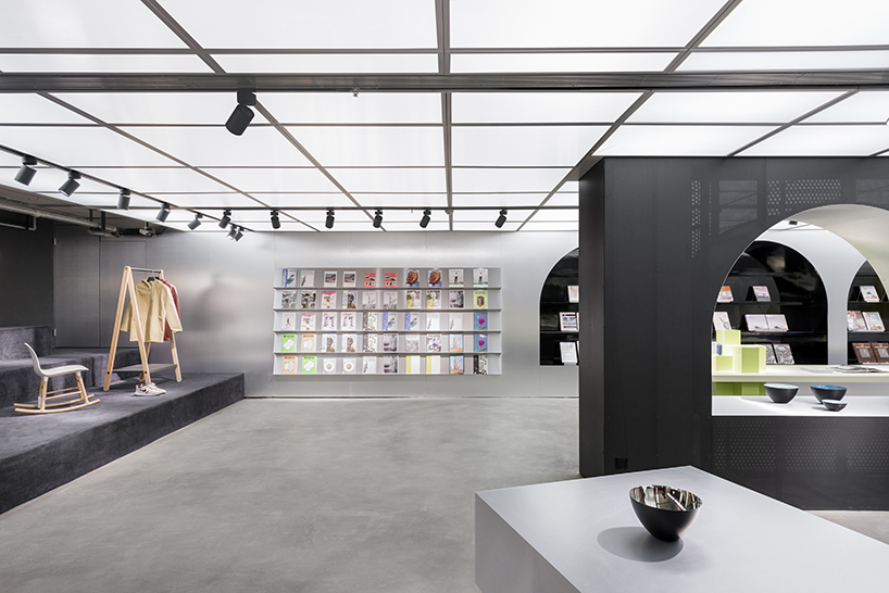 hangzhou dreamscape marries the art of books with normann copenhagen furniture, by alberto caiola