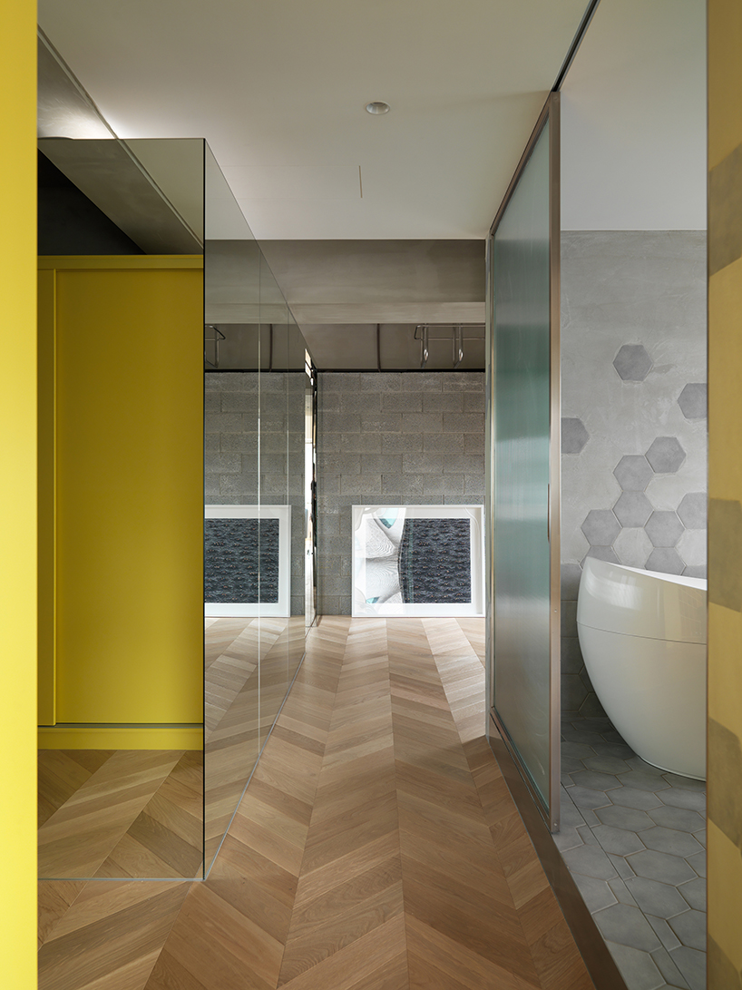 KC design studio divides taiwanese residence into private + public spheres