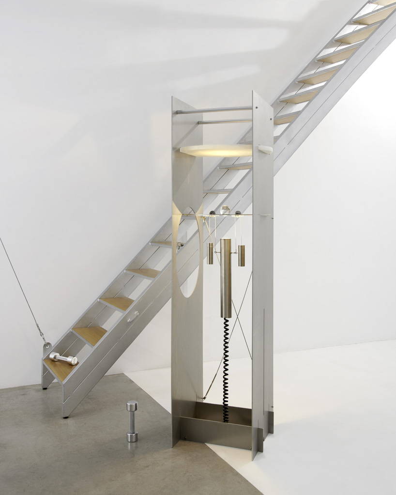 kinetic lighting activates mechanical movement in a sculpture of steel and glass