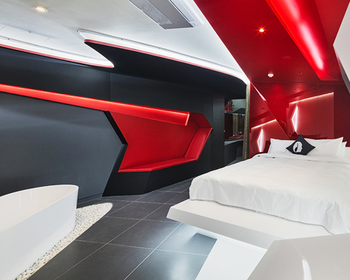 seungmo lim adds flowing curtain to geometrical hotel boutique room in korea