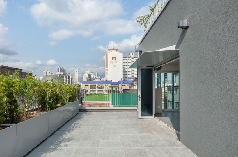 translucent facade of multicolored steel louvers unfolds along seoul’s dokkaebi market