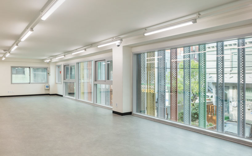 translucent facade of multicolored steel louvers unfolds along seoul’s dokkaebi market