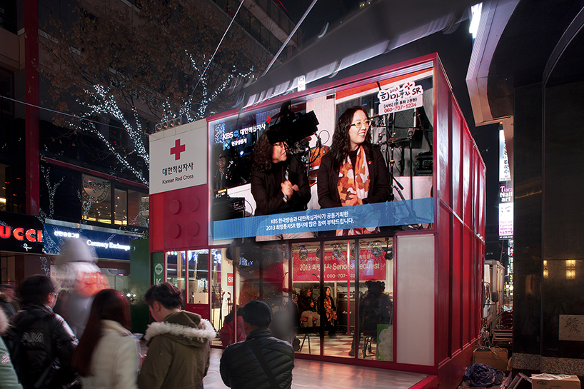 studio_GAON designs red cross cube pavilion as LEGO block