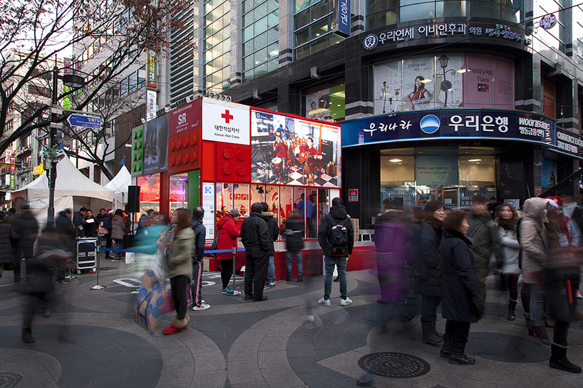 studio_GAON designs red cross cube pavilion as LEGO block