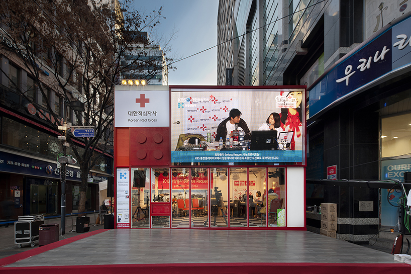 studio_GAON designs red cross cube pavilion as LEGO block