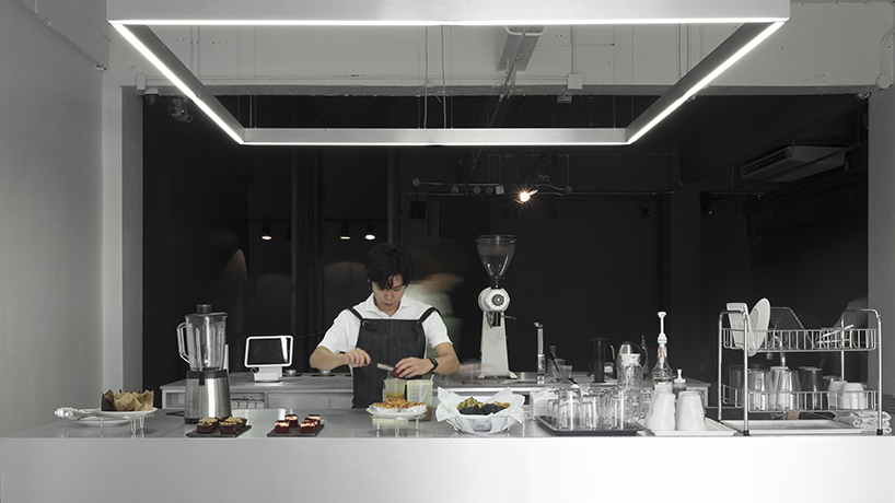 hand & heart café in bangkok by party / space / design uses a sleek aluminium interior