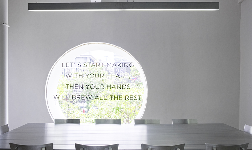 hand & heart café in bangkok by party / space / design uses a sleek aluminium interior