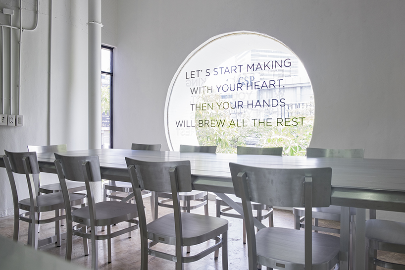 hand & heart café in bangkok by party / space / design uses a sleek aluminium interior