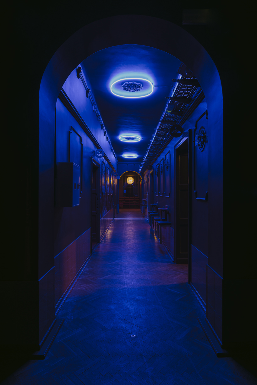 wiercinski studio mixes antiques with neon lighting for nightclub in poland