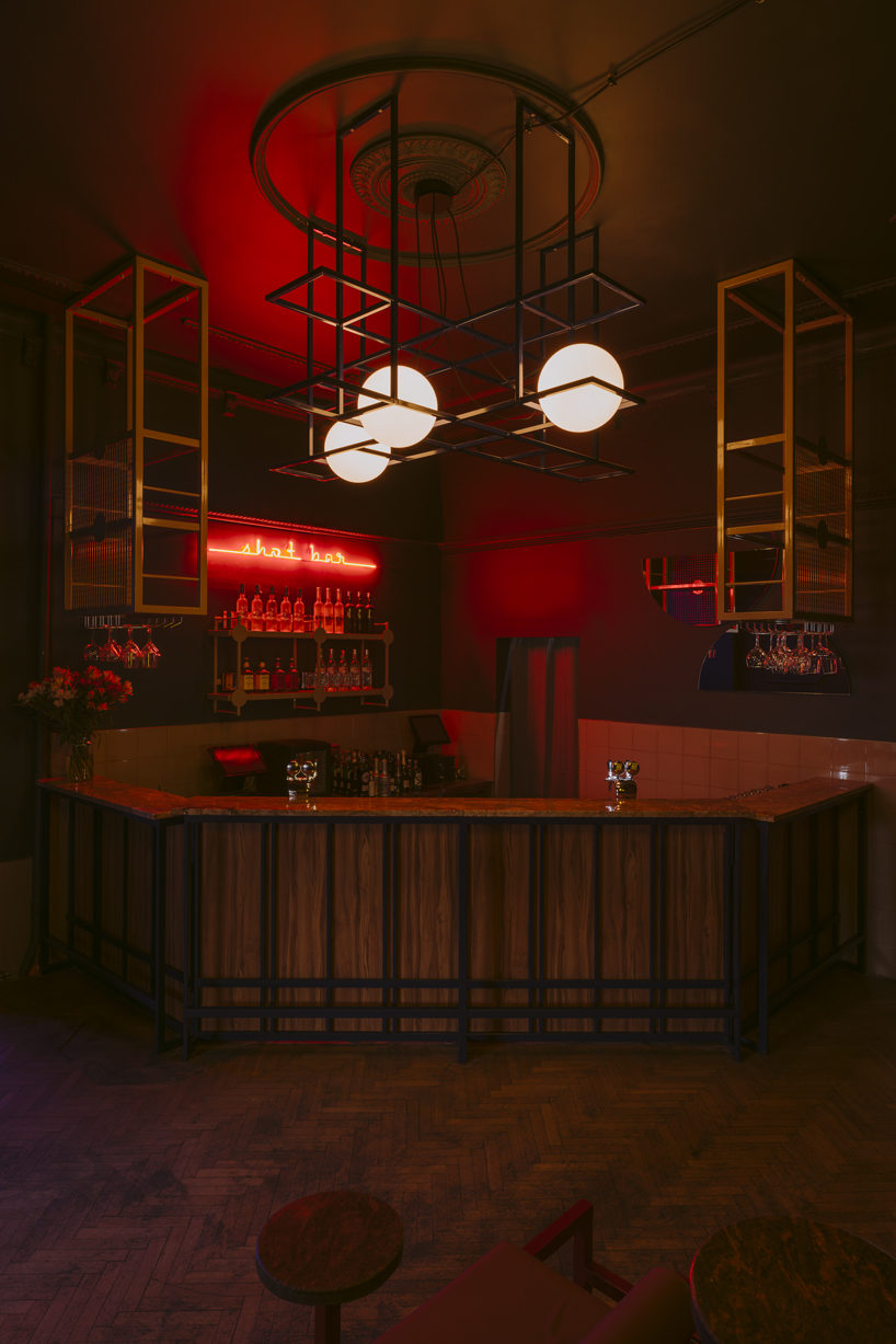 wiercinski studio mixes antiques with neon lighting to design vanity nightclub in poland designboom