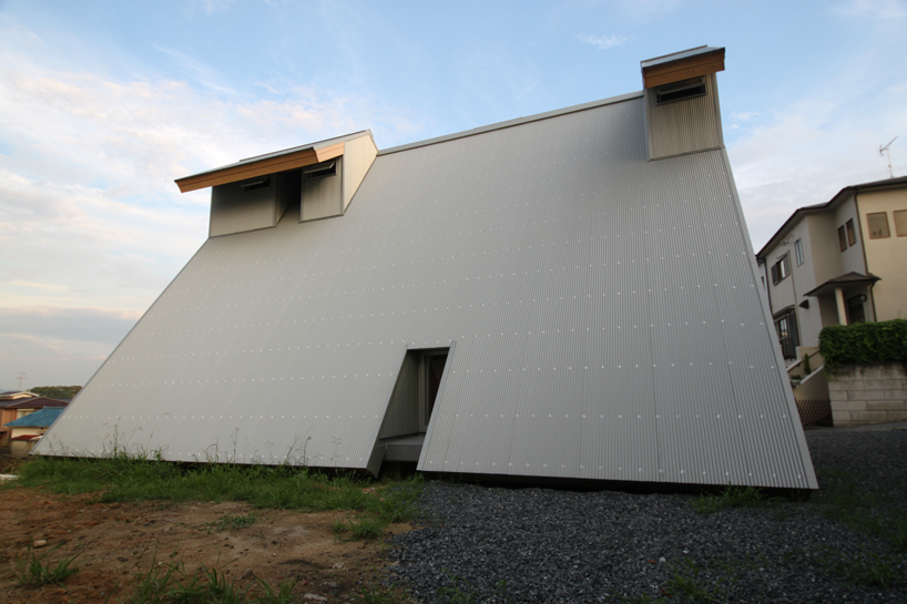 japanese home uses crafted timber sundial to support its passive system