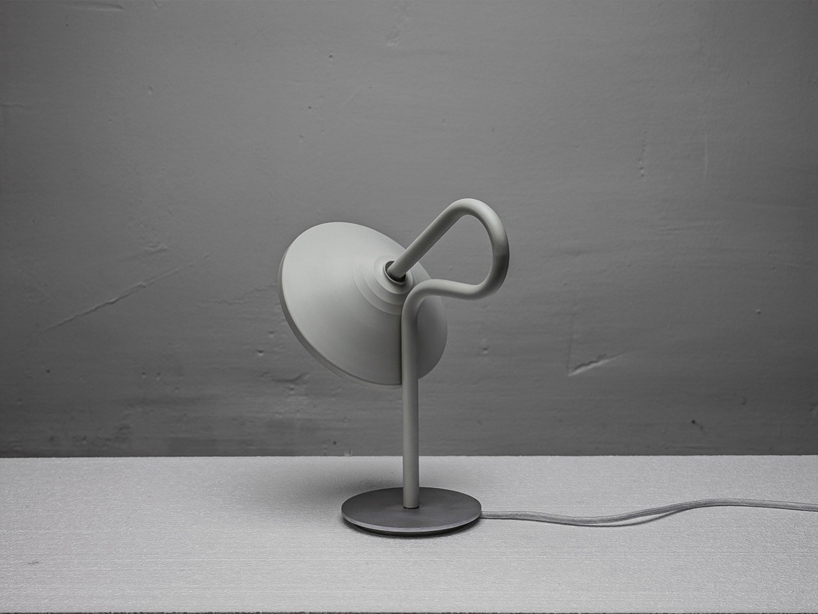 bao-nghi droste emits light from round table lamp's epicenter