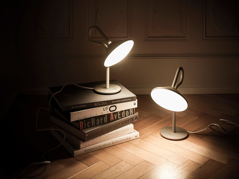 bao-nghi droste emits light from round table lamp's epicenter