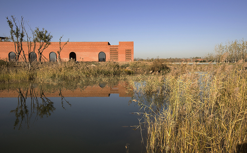 interval architects creates a botanic art center from a disused brick kiln in china