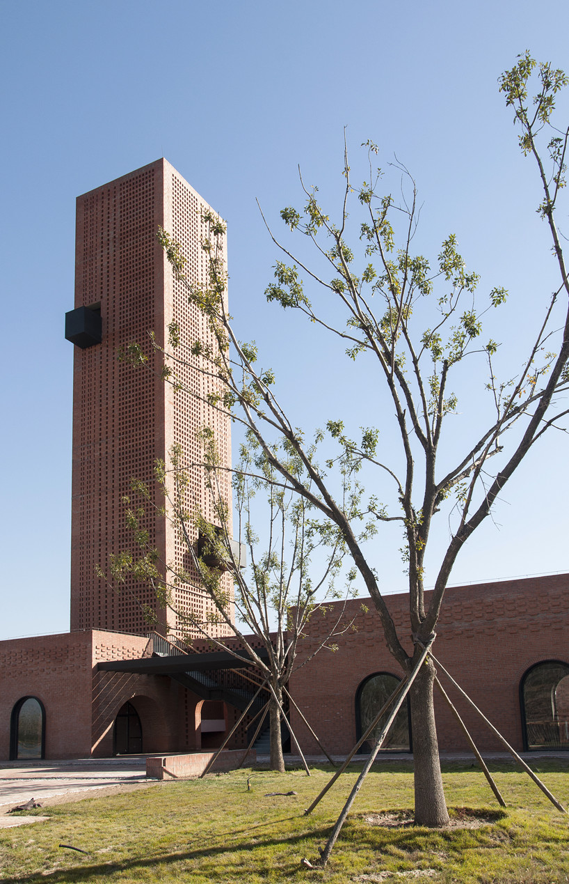 interval architects creates a botanic art center from a disused brick kiln in china