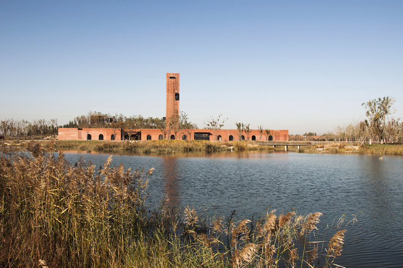 interval architects creates a botanic art center from a disused brick kiln in china