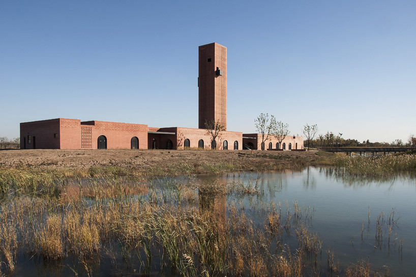 interval architects creates a botanic art center from a disused brick kiln in china