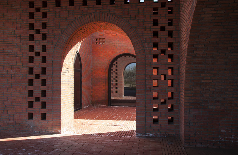 interval architects creates a botanic art center from a disused brick kiln in china