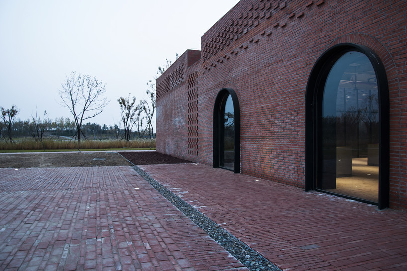 interval architects creates a botanic art center from a disused brick kiln in china