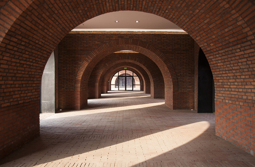 interval architects creates a botanic art center from a disused brick kiln in china