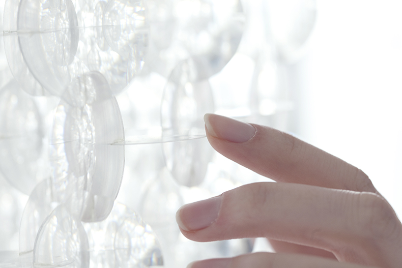 yuji okitsu combines an array of lenses into reflective 3D forms