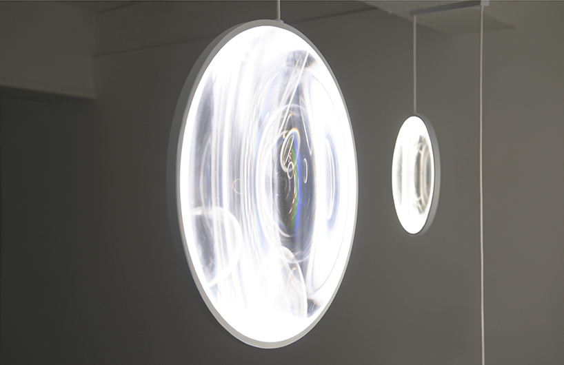 yuji okitsu’s mobile lenses sway and rotate to diffuse natural light in the interior