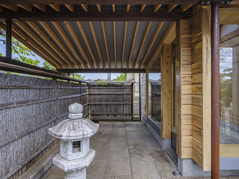 six-tatami garden tea room layers salvaged timber, titanium, and steel in ichihara, japan - 5