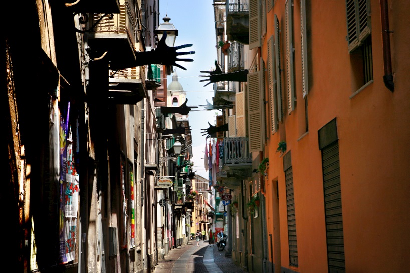 suspended hand gestures of war + peace by meinero emanuele