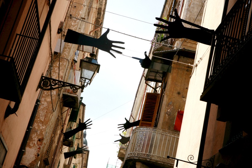 suspended hand gestures of war + peace by meinero emanuele