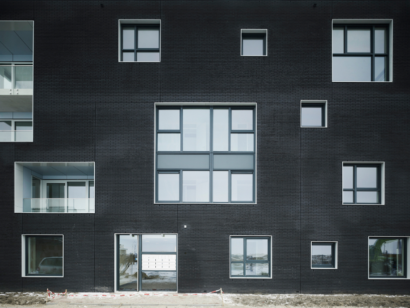 casanova hernandez architects frames twin housing blocks