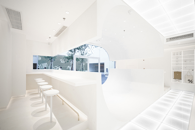ARCHIEE's white minimalist coffee store fuses japanese, chinese, and parisian cultures