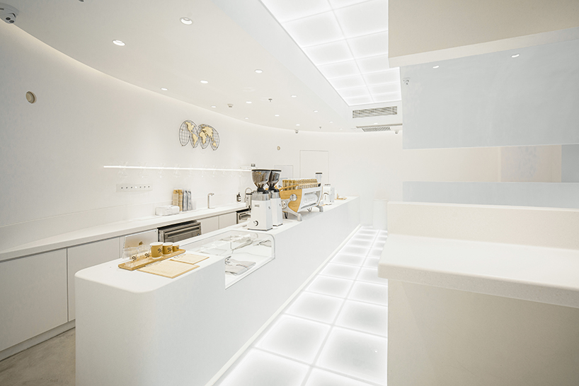 ARCHIEE's white minimalist coffee store fuses japanese, chinese, and parisian cultures