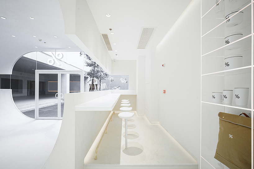 ARCHIEE's white minimalist coffee store fuses japanese, chinese, and parisian cultures