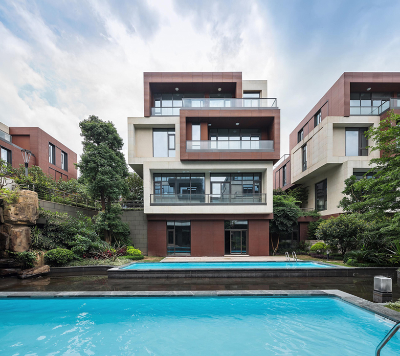 NEXT architects surrounds housing complex with water and lush greenery in china