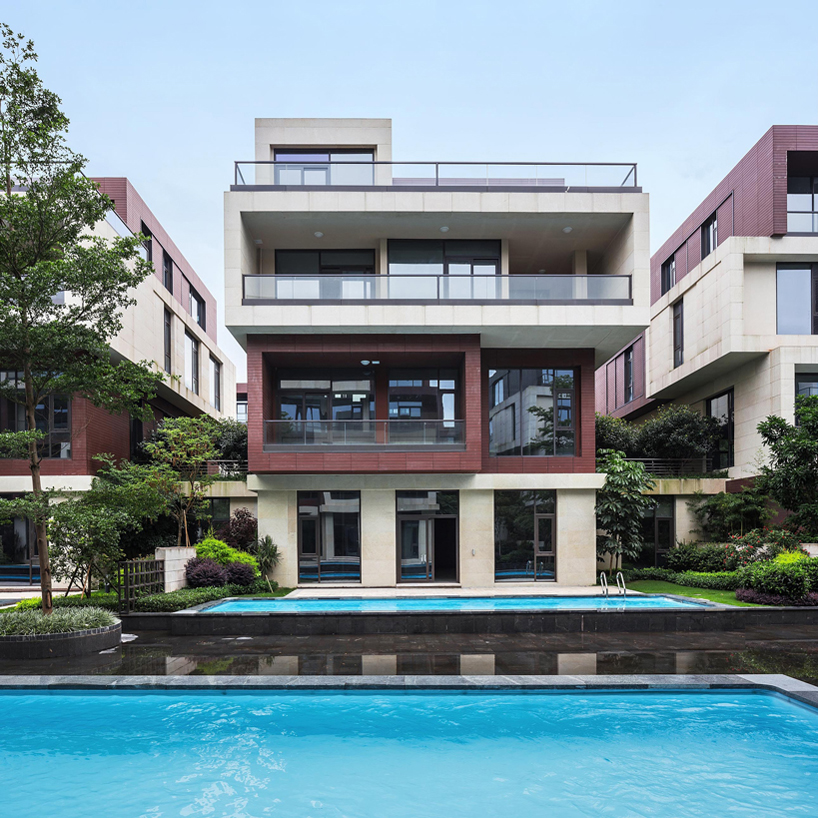 NEXT architects surrounds housing complex with water and lush greenery in china