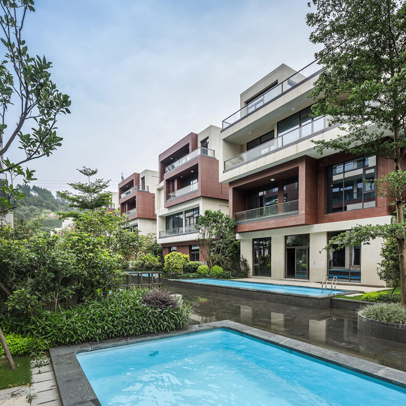 NEXT architects surrounds housing complex with water and lush greenery in china