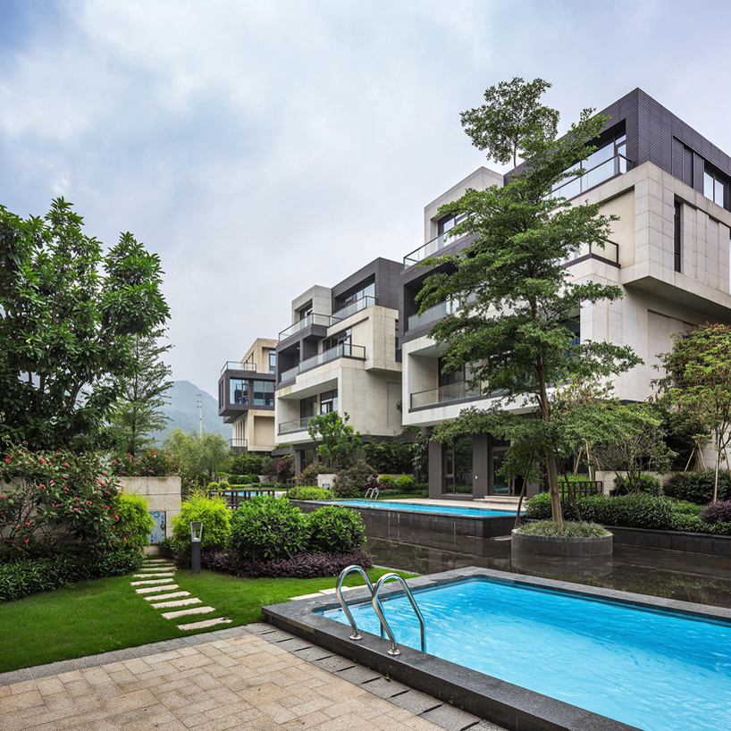 NEXT architects surrounds housing complex with water and lush greenery in china