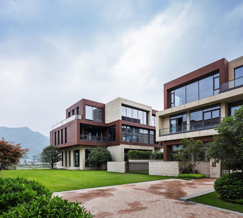 NEXT architects surrounds housing complex with water and lush greenery in china